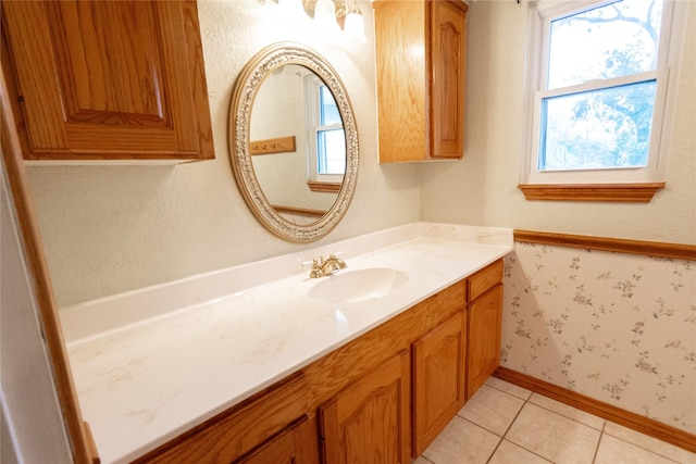 bathroom featuring tile patterned flooring and vanity