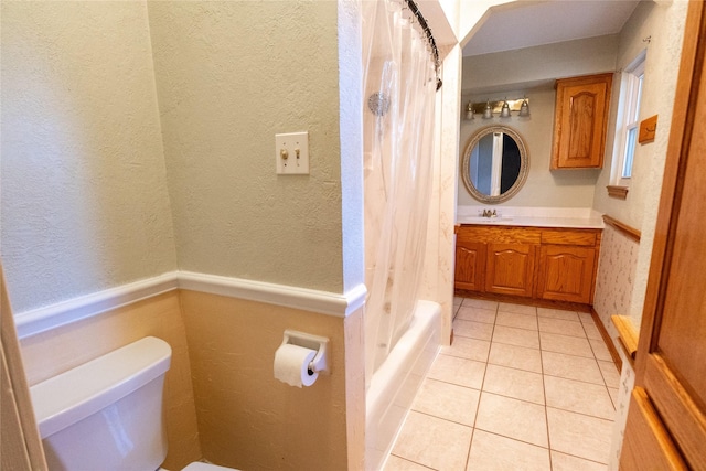 full bathroom featuring tile patterned floors, vanity, shower / bath combo, and toilet