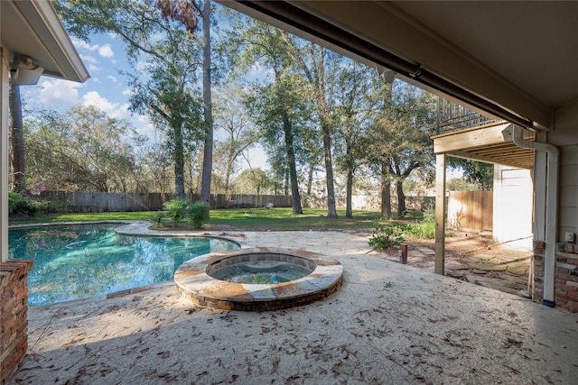 view of pool featuring an in ground hot tub