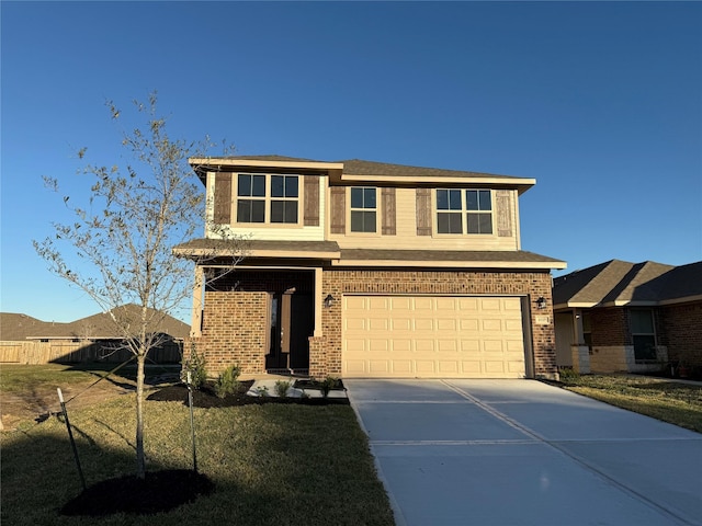 view of front facade with a garage and a front lawn