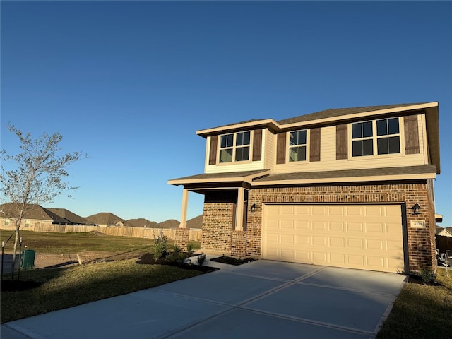 view of front facade featuring a front lawn and a garage