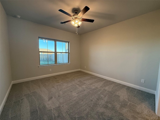 unfurnished room with carpet and ceiling fan