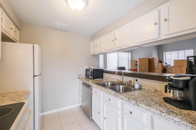 kitchen with white cabinetry, dishwasher, sink, a textured ceiling, and light tile patterned floors