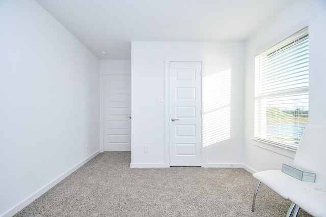 unfurnished bedroom featuring carpet and a closet