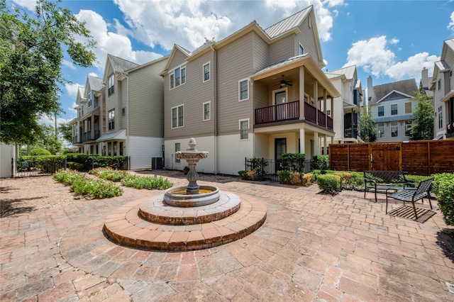 exterior space featuring a patio area, ceiling fan, a balcony, and central AC