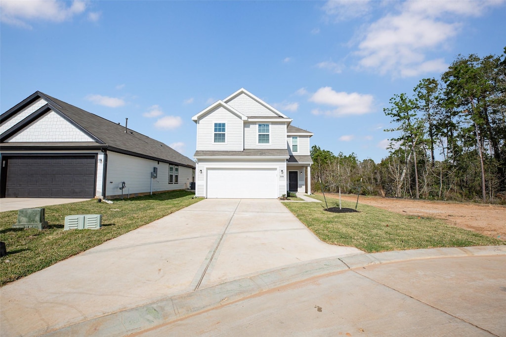 view of front facade with a front lawn and a garage