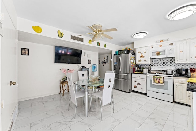 kitchen featuring ceiling fan, white cabinets, white appliances, and decorative backsplash