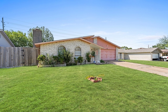 ranch-style home featuring a garage and a front yard