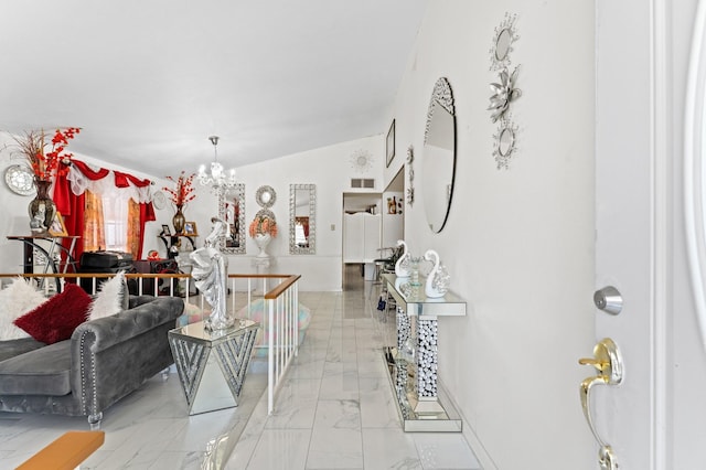 living room featuring lofted ceiling and a chandelier