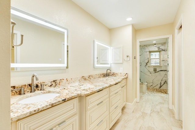 bathroom with vanity and a shower with shower door