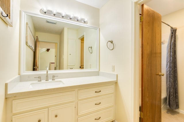 bathroom featuring vanity and shower / bath combo