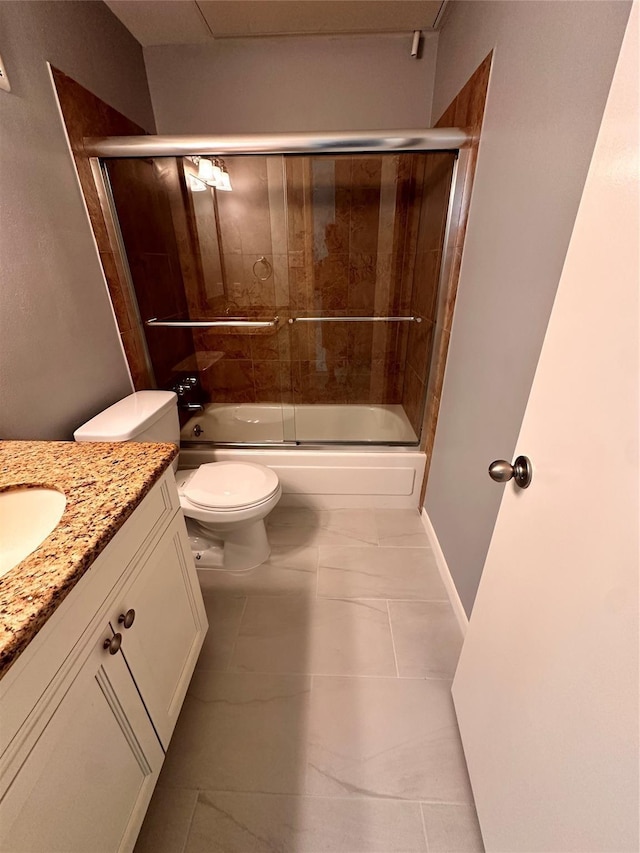 full bathroom with tile patterned floors, vanity, toilet, and enclosed tub / shower combo