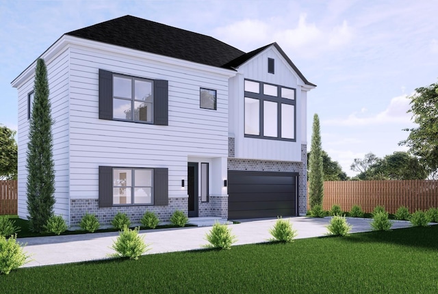 view of front of house featuring a garage and a front lawn