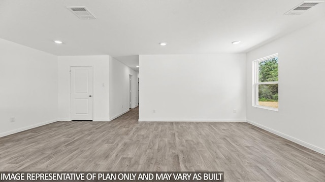 unfurnished room featuring light wood-type flooring