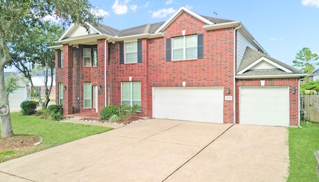 view of front of house featuring a garage and a front yard