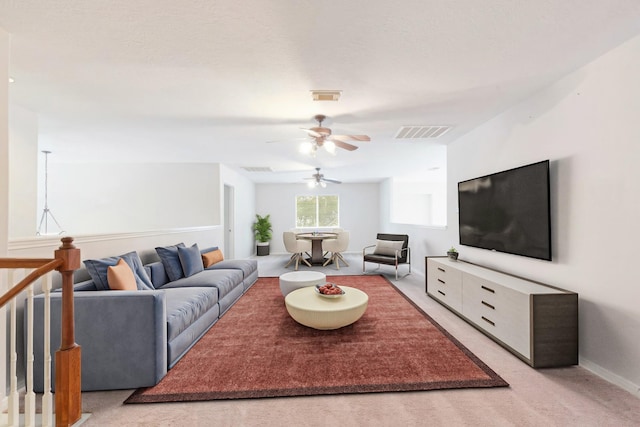 living room featuring light carpet