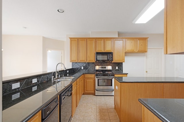 kitchen with decorative backsplash, sink, black appliances, light tile patterned floors, and dark stone countertops