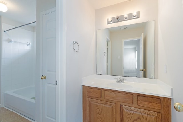 bathroom featuring tile patterned floors, shower / tub combination, and vanity