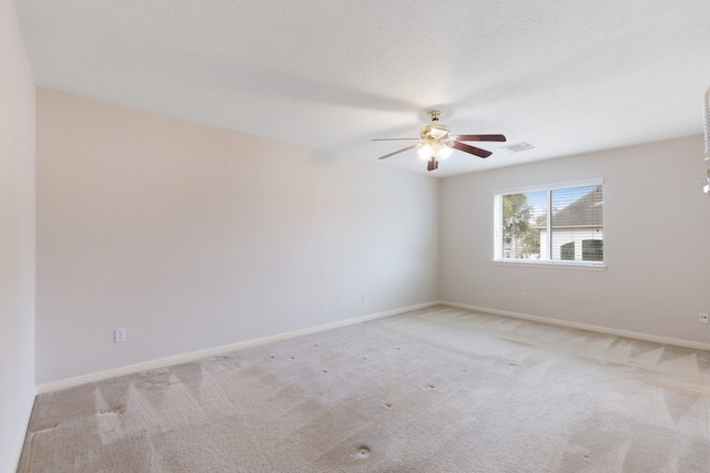 unfurnished room with light carpet and ceiling fan