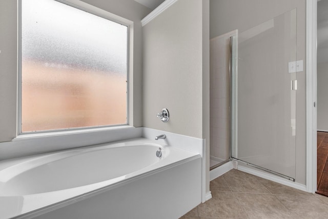 bathroom with tile patterned flooring and plus walk in shower