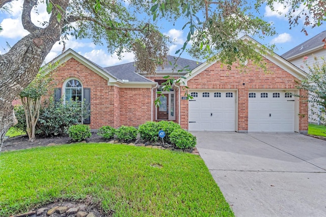 view of front of home with a garage and a front yard