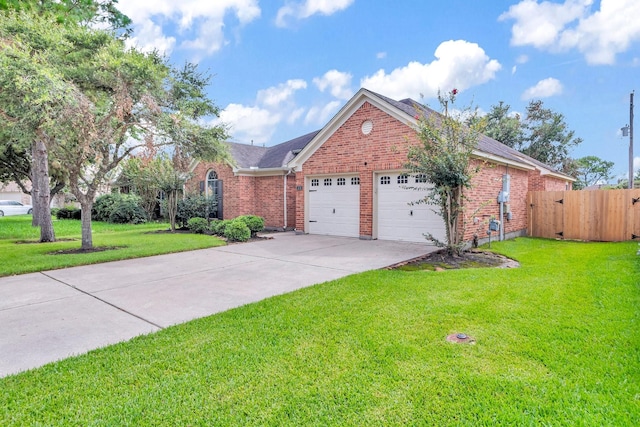 view of front of home featuring a garage and a front yard