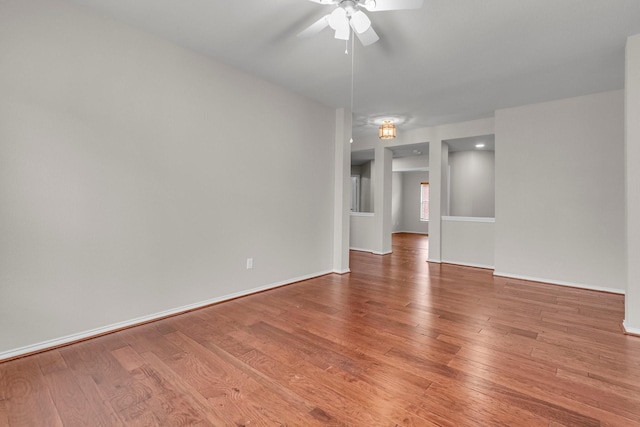 unfurnished room with hardwood / wood-style flooring and ceiling fan