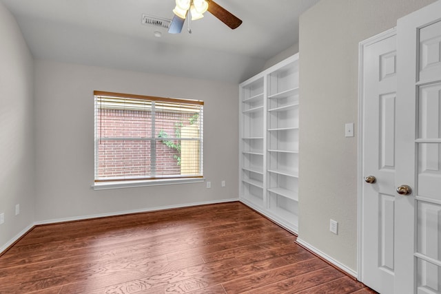 unfurnished room with ceiling fan, dark hardwood / wood-style flooring, and lofted ceiling