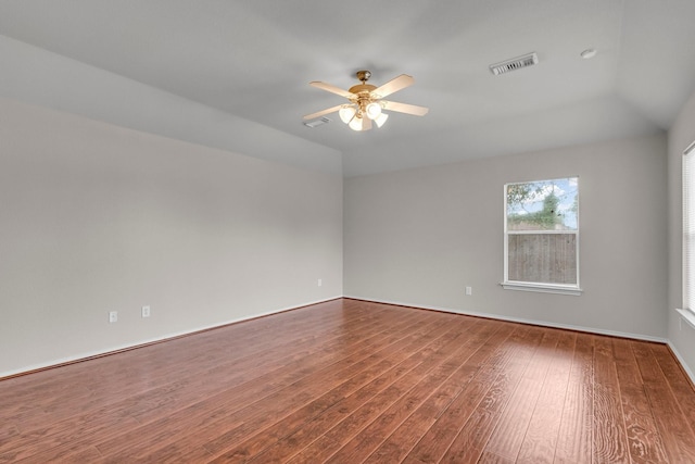 spare room with ceiling fan, lofted ceiling, and hardwood / wood-style flooring