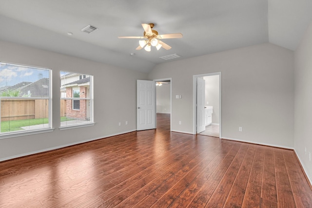 empty room featuring dark hardwood / wood-style flooring, ceiling fan, and lofted ceiling