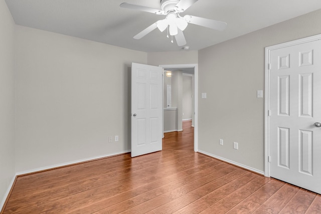 unfurnished bedroom with wood-type flooring and ceiling fan