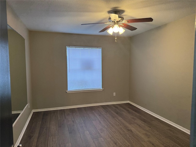 unfurnished room featuring ceiling fan, dark hardwood / wood-style flooring, and a textured ceiling