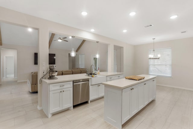 kitchen with visible vents, a sink, dishwasher, open floor plan, and a center island