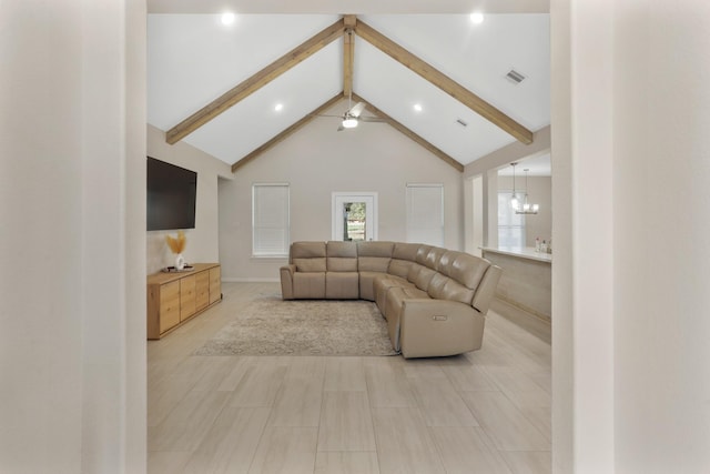 living room with beamed ceiling, ceiling fan with notable chandelier, and high vaulted ceiling