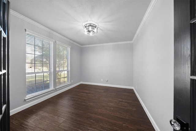 empty room featuring crown molding and dark wood-type flooring