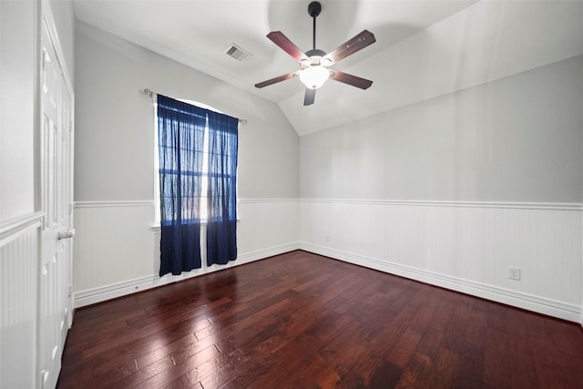 empty room featuring ceiling fan, wood-type flooring, and vaulted ceiling