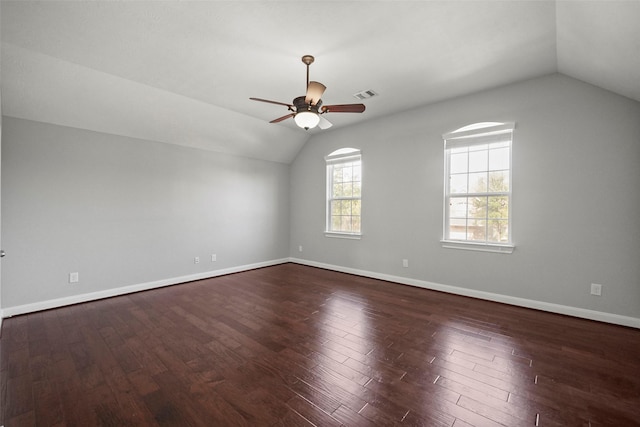 unfurnished room featuring dark wood-type flooring, ceiling fan, and lofted ceiling