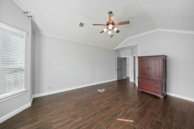 unfurnished bedroom with multiple windows, ceiling fan, crown molding, and vaulted ceiling