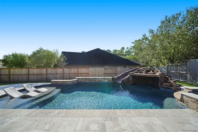 view of swimming pool featuring a water slide