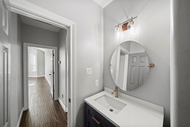 bathroom with vanity and hardwood / wood-style flooring