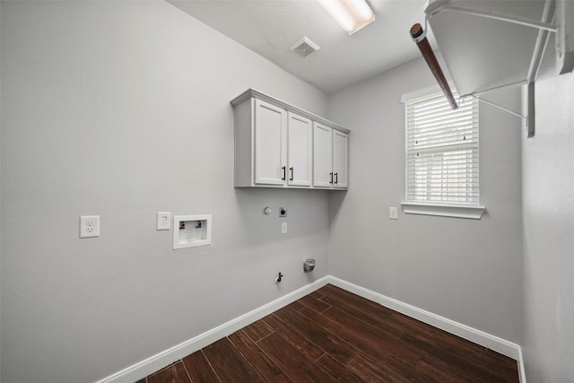 washroom featuring electric dryer hookup, gas dryer hookup, hookup for a washing machine, and cabinets