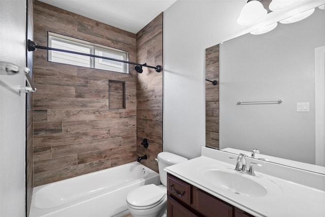 full bathroom with vanity, tiled shower / bath combo, and toilet