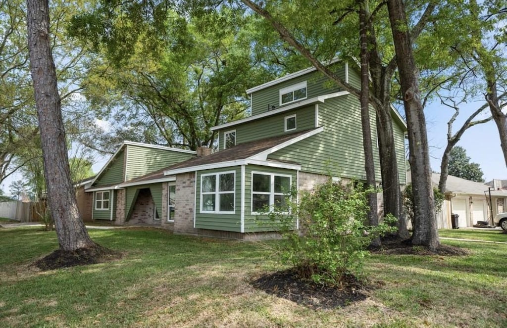 back of house with a yard