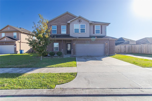 view of front property featuring a garage and a front yard