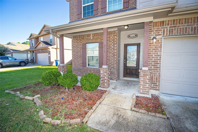 doorway to property featuring a porch and a yard