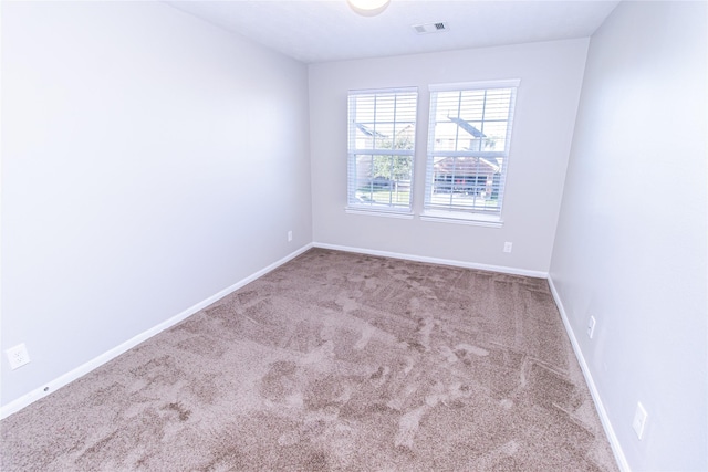 spare room with carpet