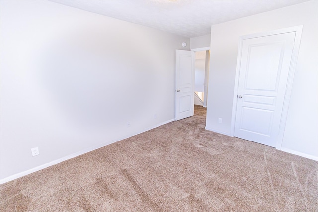 unfurnished bedroom featuring carpet flooring