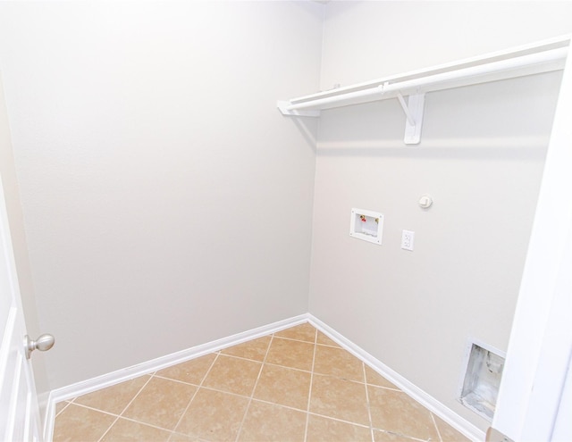 washroom featuring gas dryer hookup, tile patterned flooring, and washer hookup