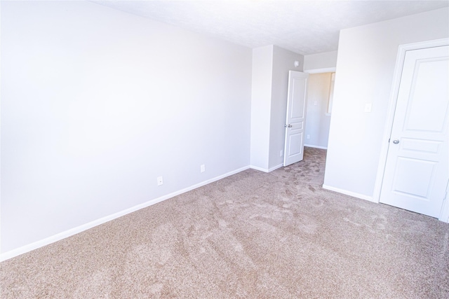 unfurnished bedroom with light carpet