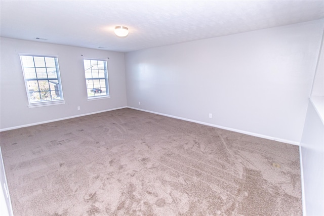 spare room featuring carpet flooring